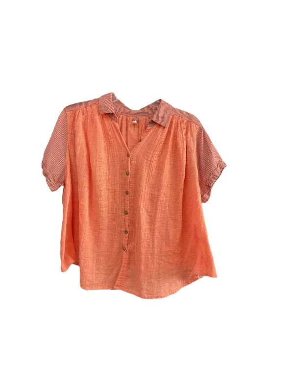 women's tops for those who want to wear versatile pieces that can be dressed up or downTop Short Sleeve By Free People In Coral, Size: M